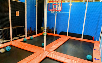 Trampoline basketball court at Amazonia Singapore indoor playground.
