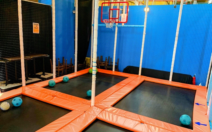 Trampoline basketball court at Amazonia Singapore indoor playground.