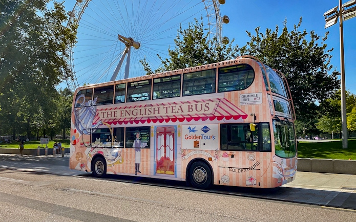 Afternoon Tea Bus parked near the London Eye, offering a unique sightseeing experience.