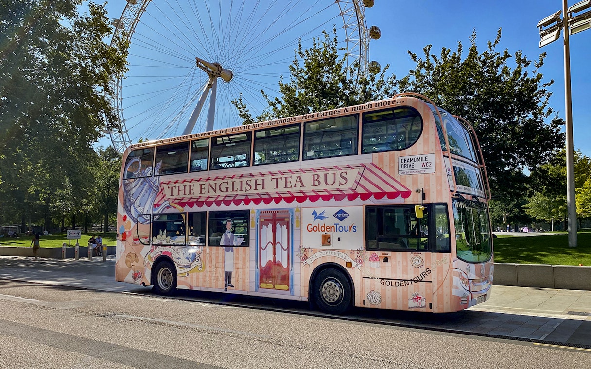 Afternoon Tea Bus parked near the London Eye, offering a unique sightseeing experience.