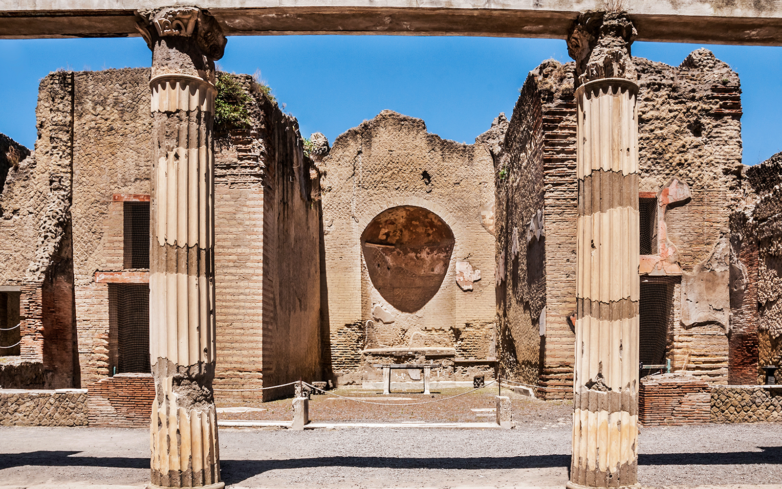 Ancient columns and walls at Herculaneum ruins in Italy.