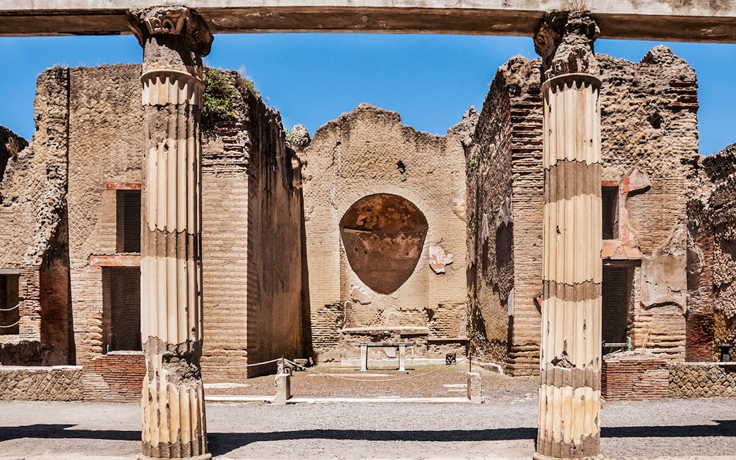 Ancient columns and walls at Herculaneum ruins in Italy.