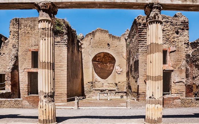 Ancient columns and walls at Herculaneum ruins in Italy.