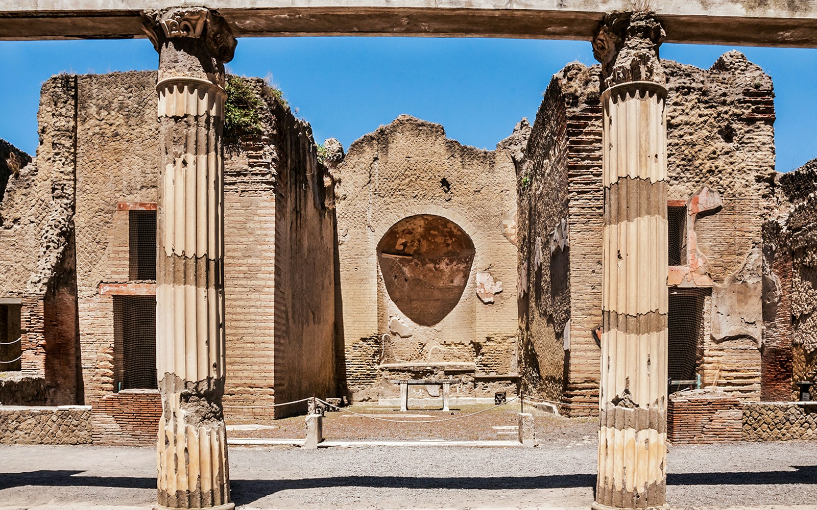 Ancient columns and walls at Herculaneum ruins in Italy.