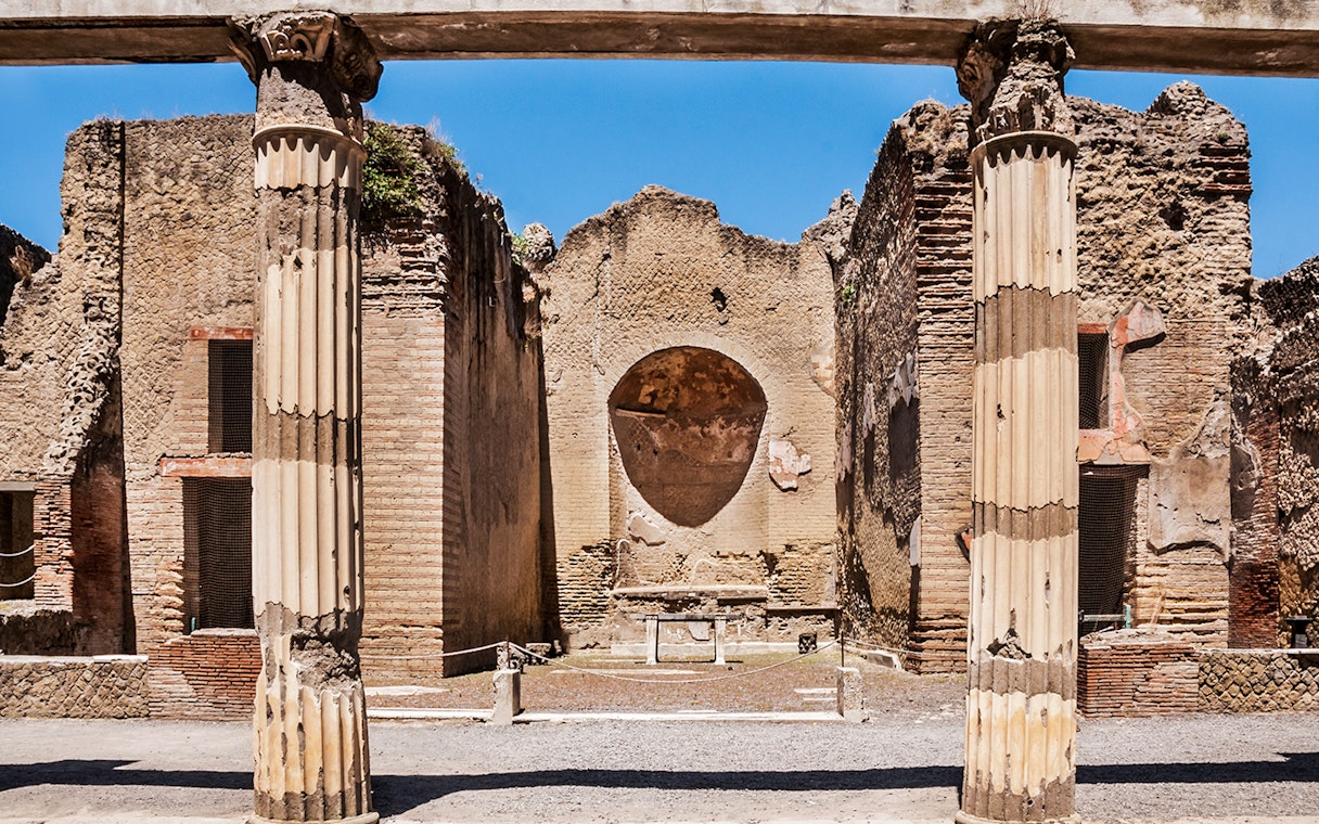 Ancient columns and walls at Herculaneum ruins in Italy.