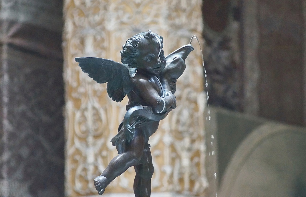 Putto with Dolphin statue at Palazzo Vecchio, Florence, Italy.