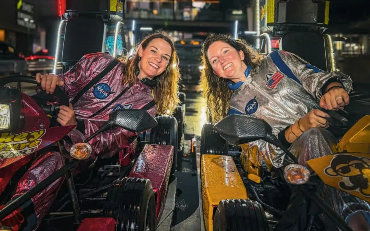 Two people in go-karts during Shibuya Crossing & Tokyo Tower Go-Karting Experience.