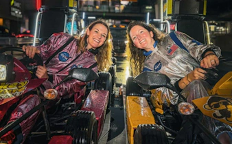 Two people in go-karts during Shibuya Crossing & Tokyo Tower Go-Karting Experience.