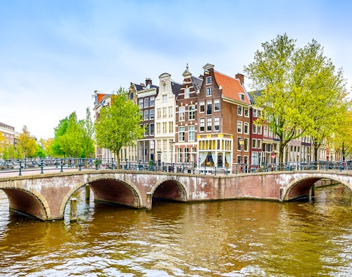 Canal bridge and historic buildings in Grachtengordel, Amsterdam.