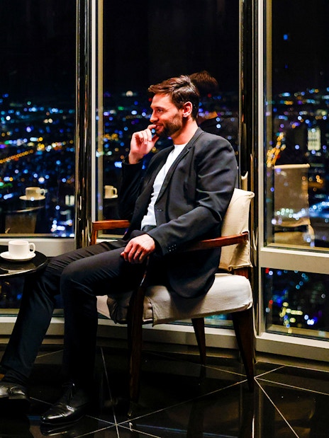 Couple enjoying night view from Burj Khalifa Level 152 Lounge.