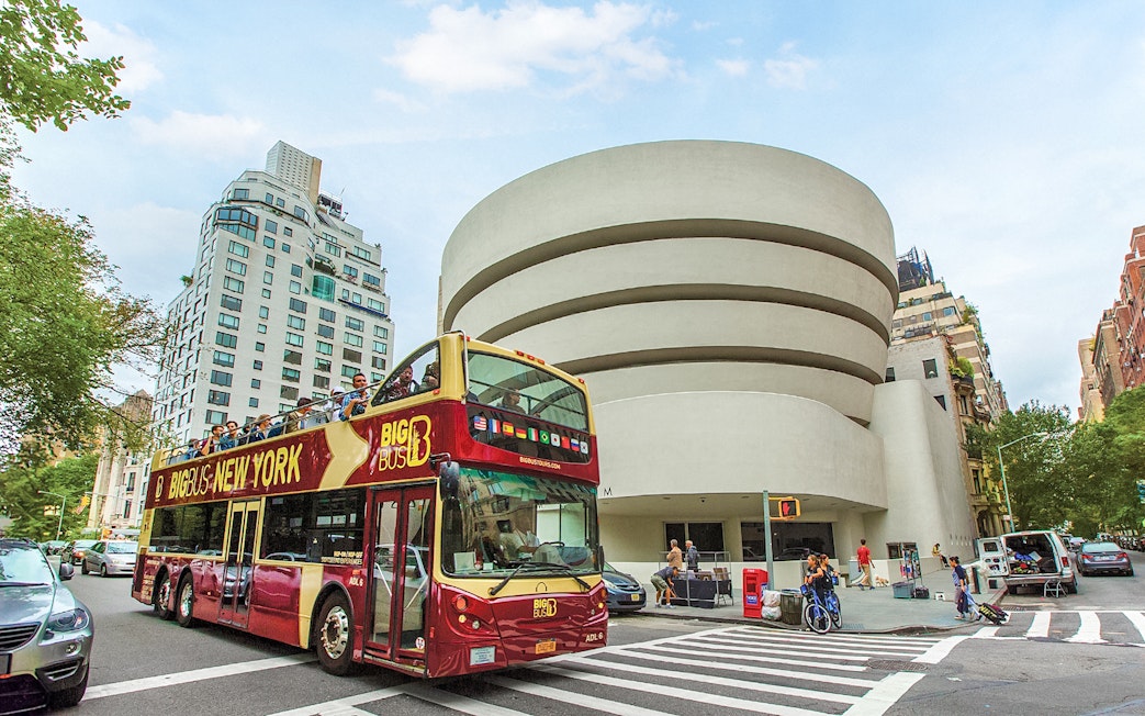 Big Bus tour passing the Guggenheim Museum in New York City.
