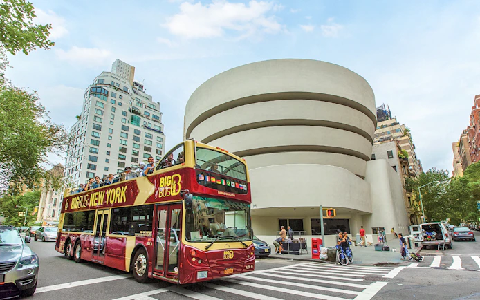 Big Bus tour passing the Guggenheim Museum in New York City.