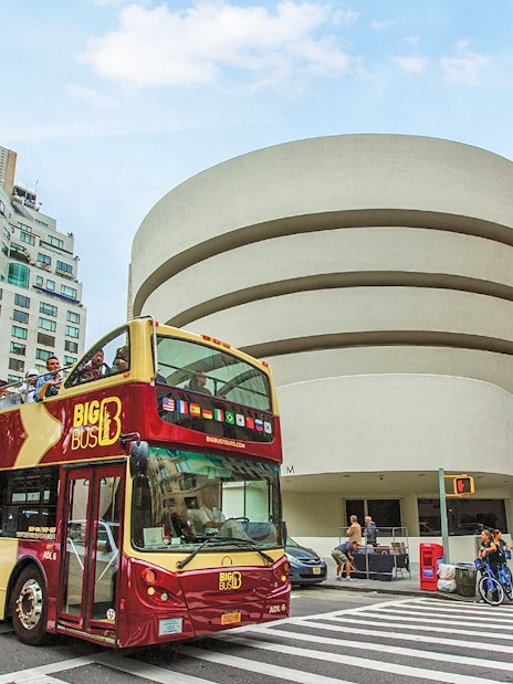 Big Bus tour passing the Guggenheim Museum in New York City.