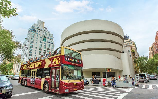 Big Bus tour passing the Guggenheim Museum in New York City.