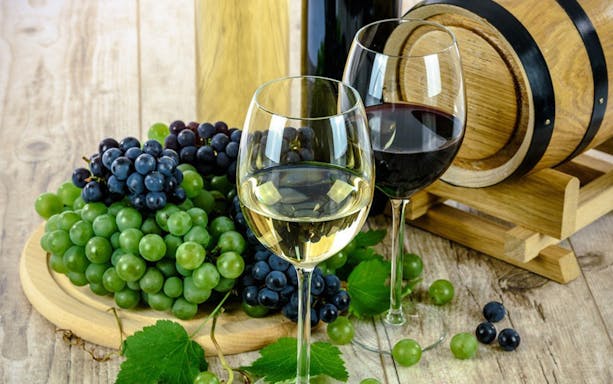 Grapes and wine glasses at an Algarve winery tour.