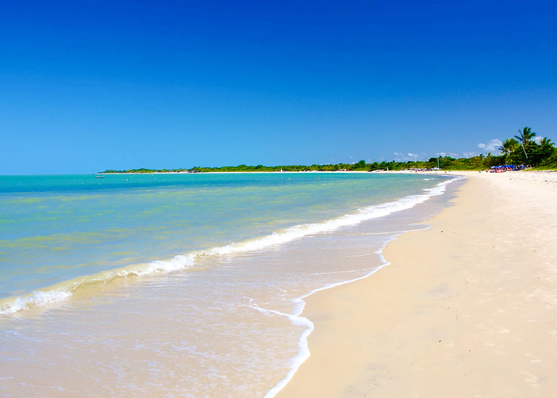 Sandy beach with clear water at Coroa Vermelha, Porto Seguro, Brazil.
