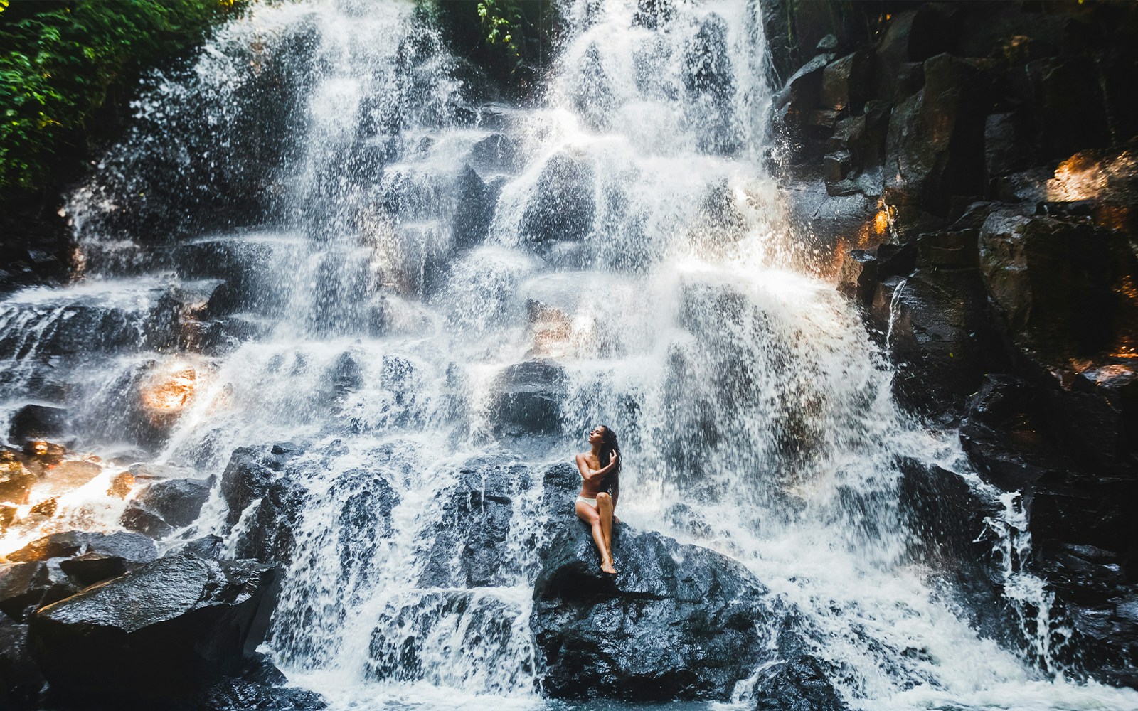 Woman at Kanto waterfall in Bali