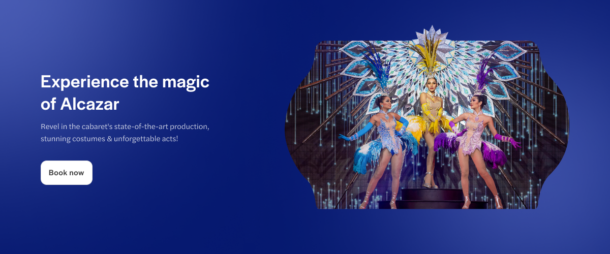 Alcazar cabaret performers in vibrant costumes on stage, Pattaya, Thailand.