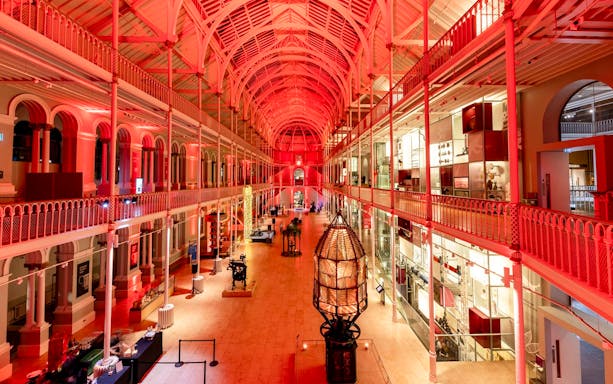 National Museum of Scotland interior with red lighting and exhibits, Edinburgh.