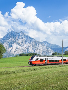 Train traveling through Austrian Alps with Eurail Pass.