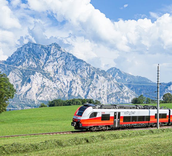 Train traveling through Austrian Alps with Eurail Pass.