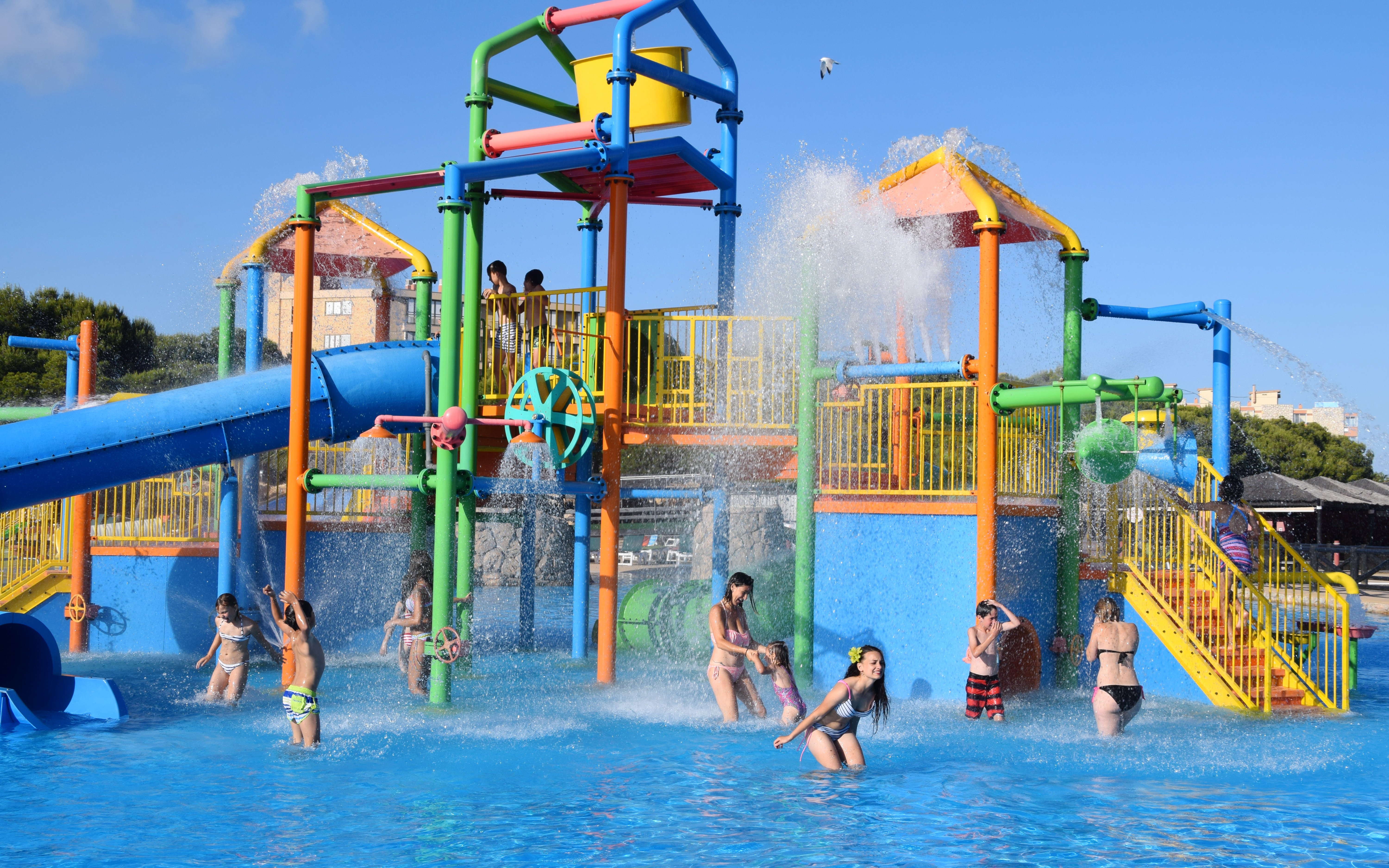 Children playing in water playground at Aquopolis Costa Daurada, Tarragona.