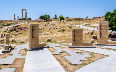 Amman Citadel ruins with ancient columns and stone markers in Jordan.