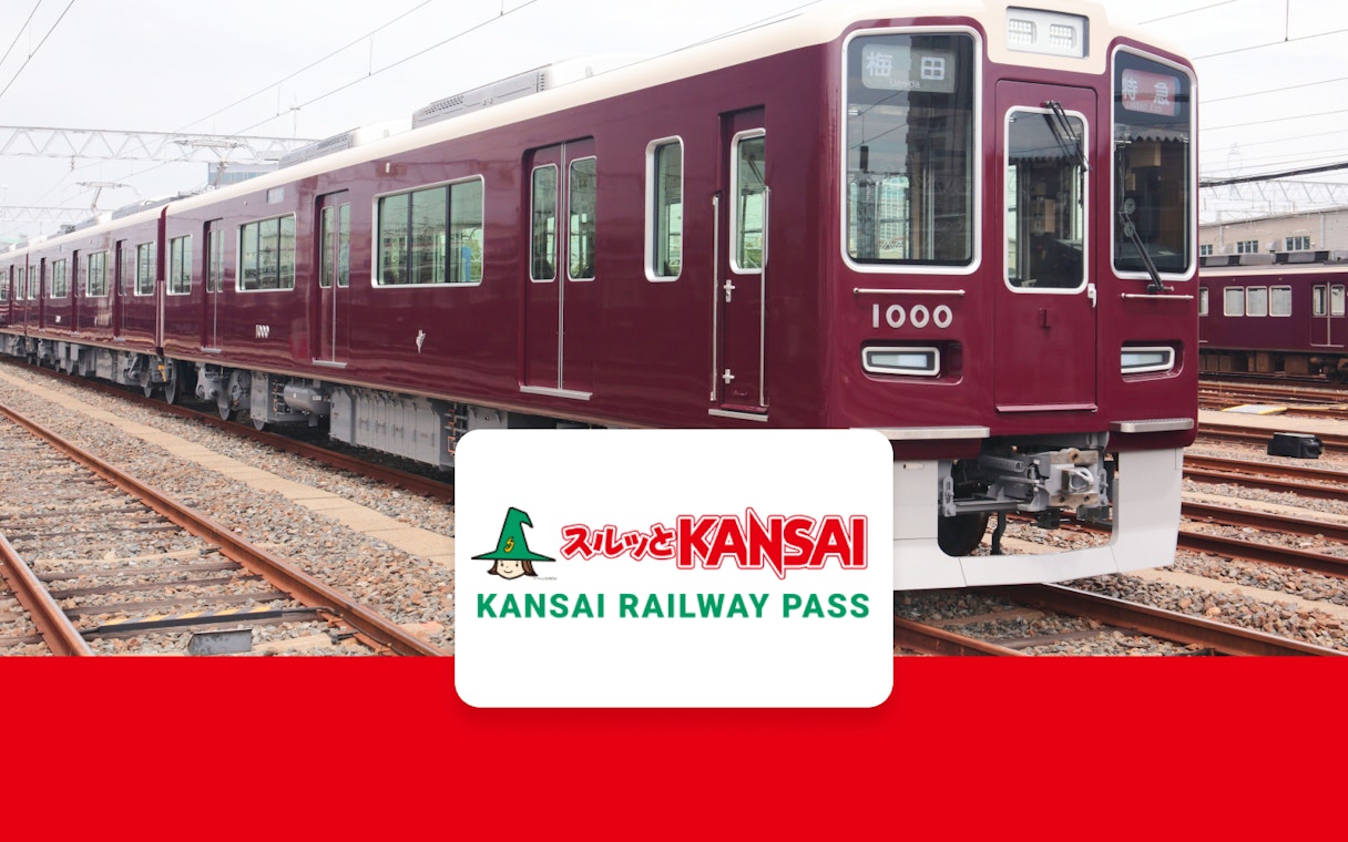 Kansai Railway train on tracks with Kansai Railway Pass logo.