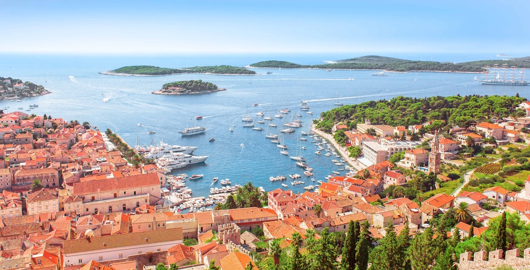 Hvar Island harbor with boats and historic buildings, Croatia.