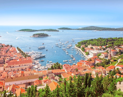 Hvar Island harbor with boats and historic buildings, Croatia.