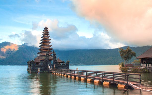 Ulun Danu Batur Temple on Lake Batur with mountain backdrop, Bali.