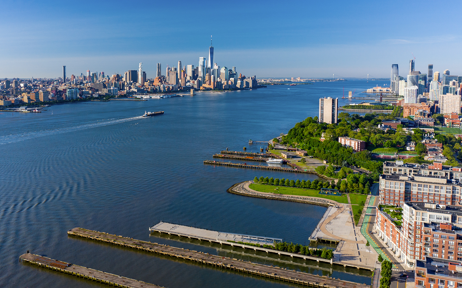 Aerial view of Hudson River with New York City skyline in the background.