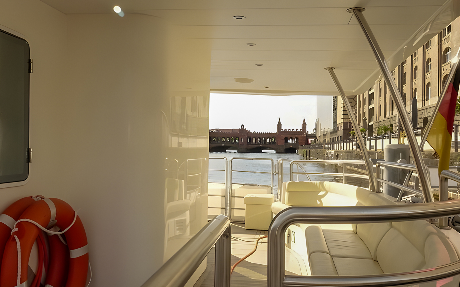 Solar catamaran interior with view of Berlin's Oberbaum Bridge on city highlights tour.