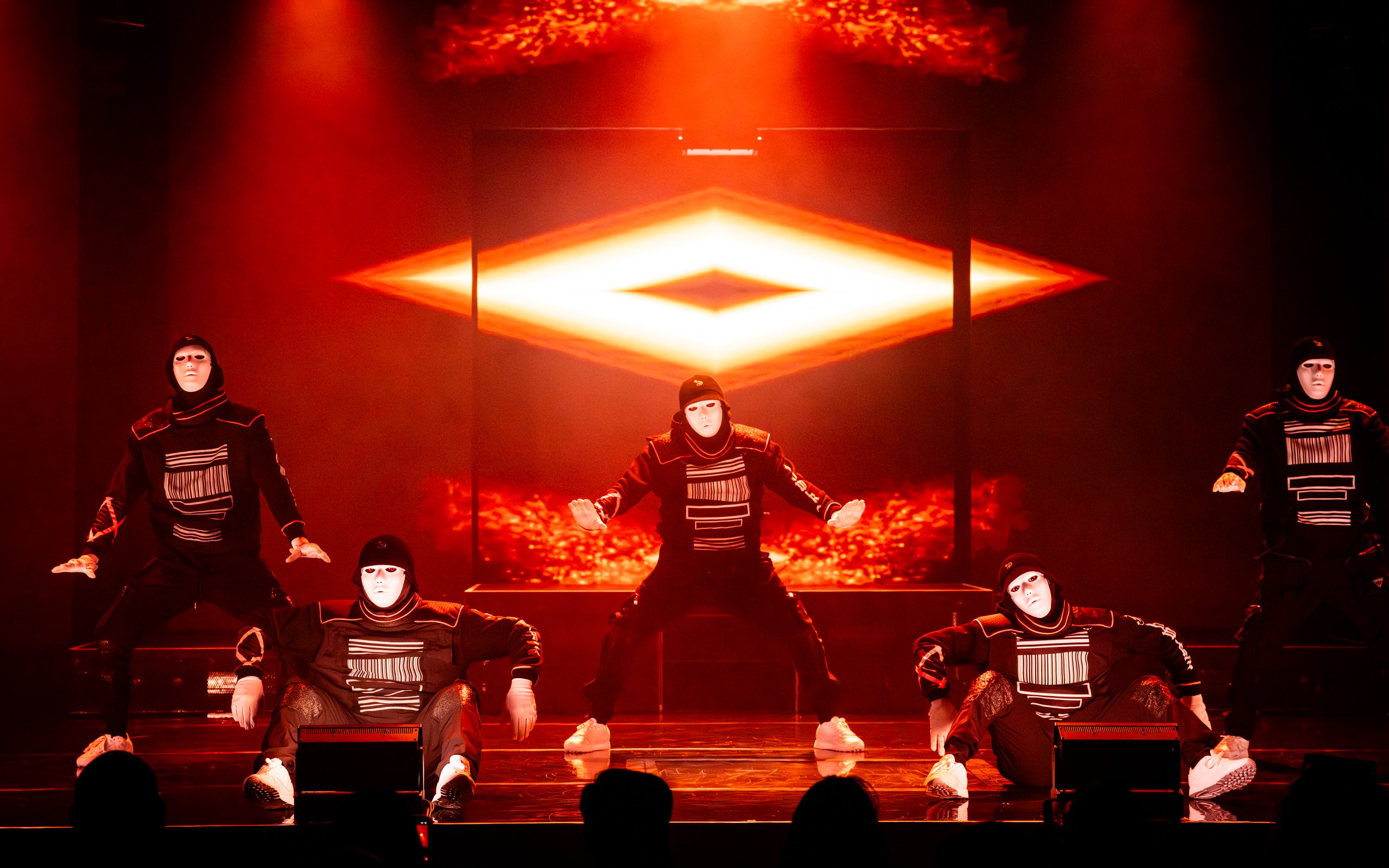 Dancers in masks performing at Jabbawockeez show, Las Vegas stage.