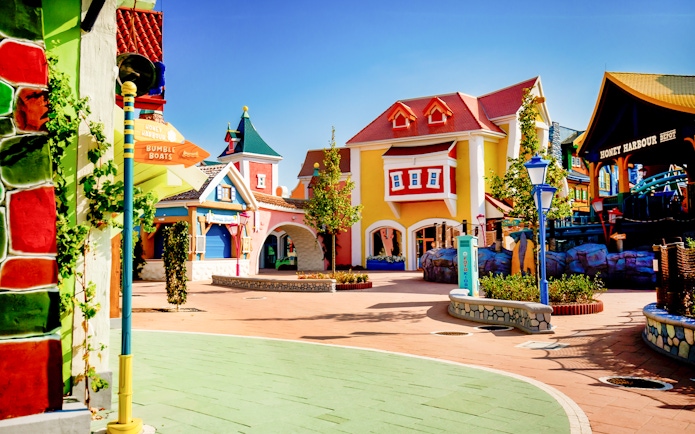 Colorful buildings and signs in Energylandia Theme Park, Zator, near Krakow, Poland.