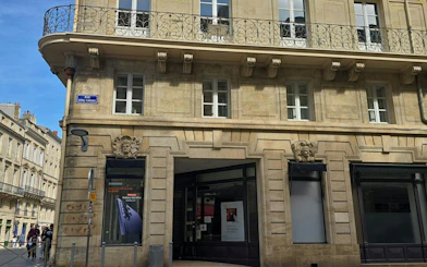 Historic building on Rue Vital-Carles in Bordeaux, part of the Murder Mystery city exploration game.