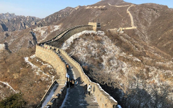 Visitors walking along the Mutianyu section of the Great Wall in winter, Beijing, China.