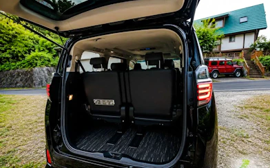Open trunk of a private transfer vehicle at Haneda Airport for Tokyo city transport.