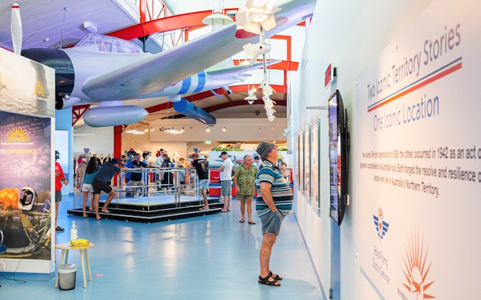Visitors exploring the Alice Springs Royal Flying Doctor Service museum exhibit.
