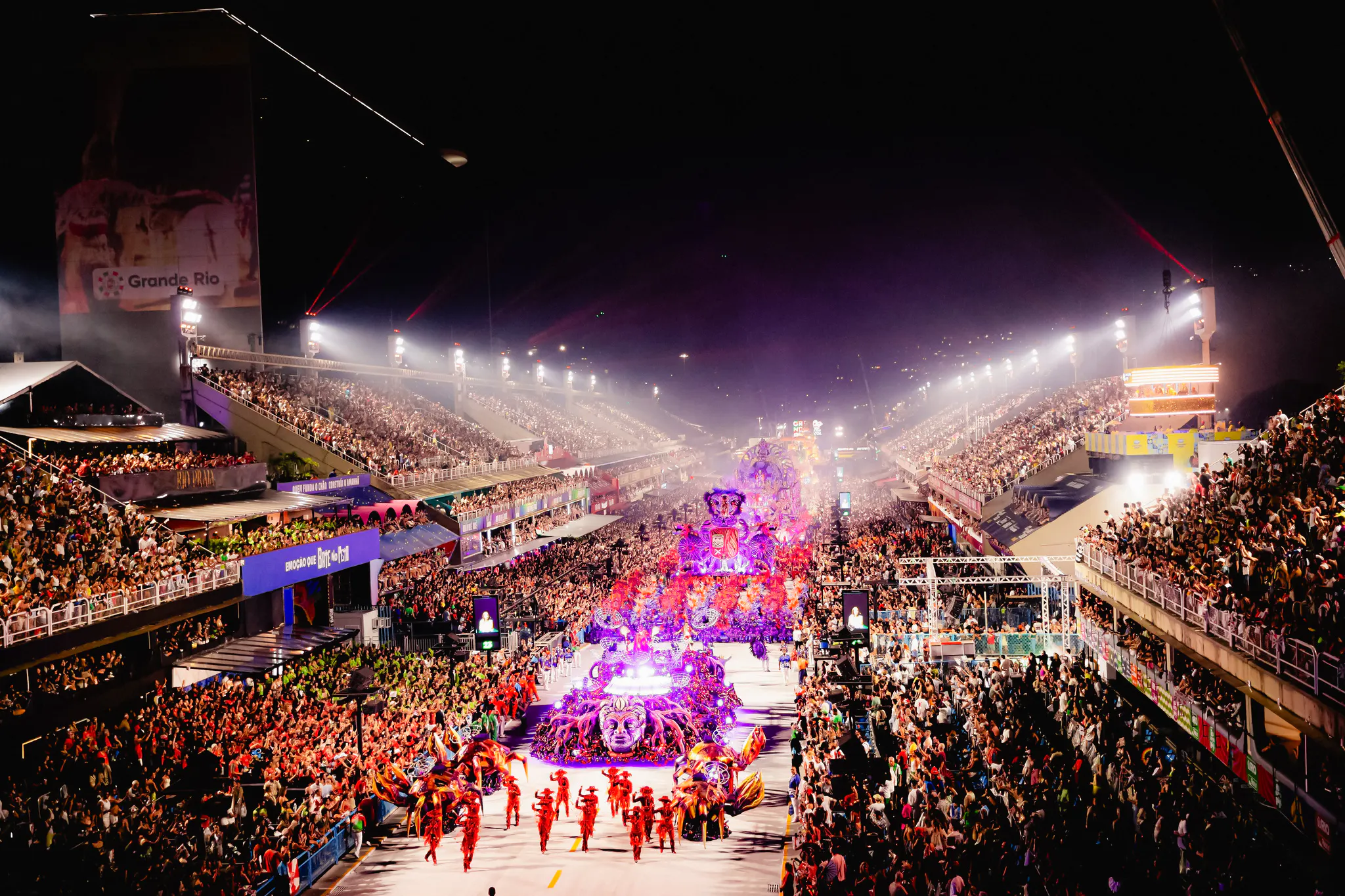 Parade at Rio Carnival 2027, Marquês de Sapucaí, Rio de Janeiro, with vibrant floats and crowds.