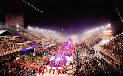 Parade at Rio Carnival 2027, Marquês de Sapucaí, Rio de Janeiro, with vibrant floats and crowds.