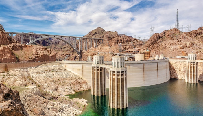 Hoover Dam view with Colorado River and surrounding desert landscape, Nevada, USA.