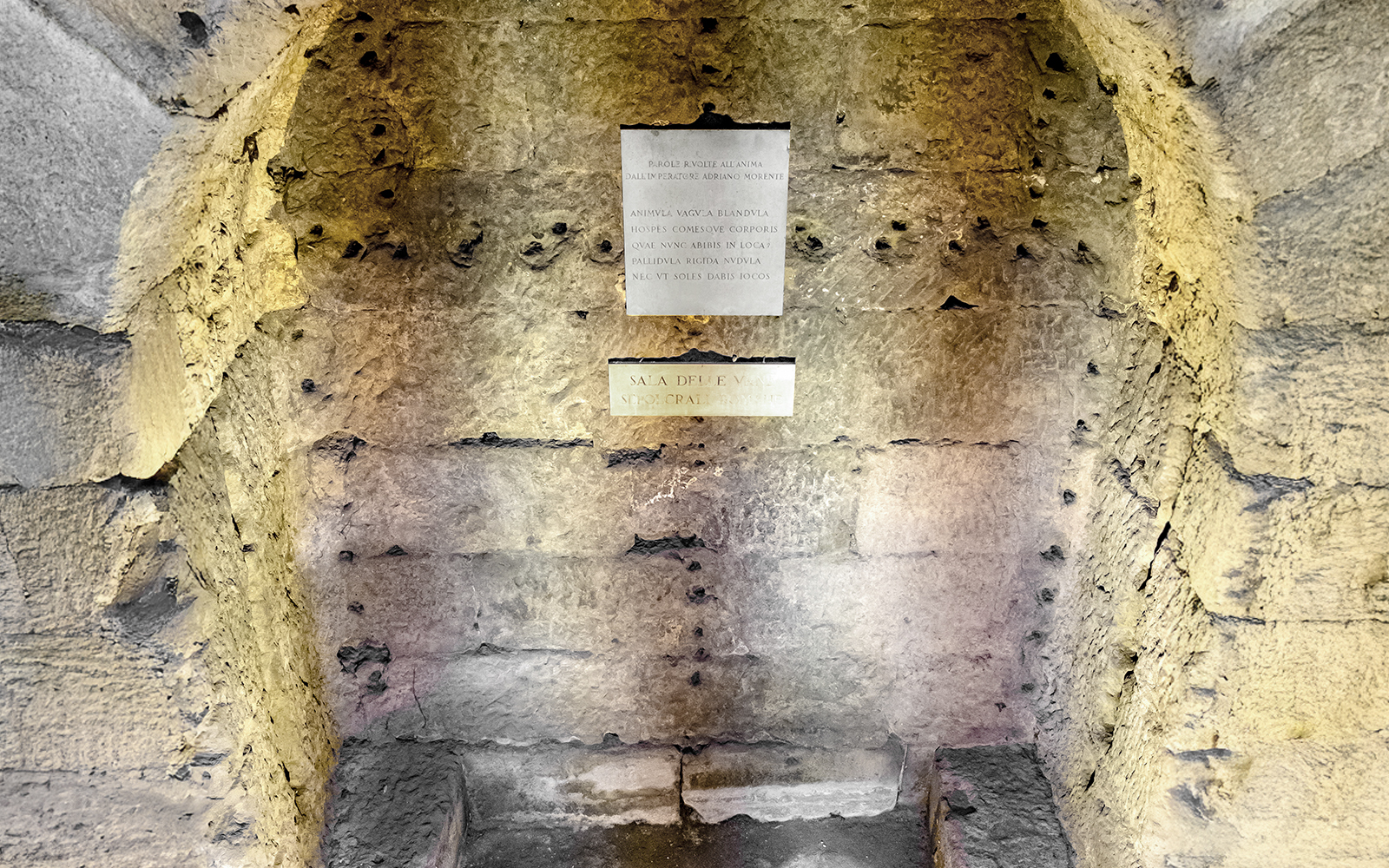 Castel Sant'Angelo Urn Room stone wall with Latin inscriptions.