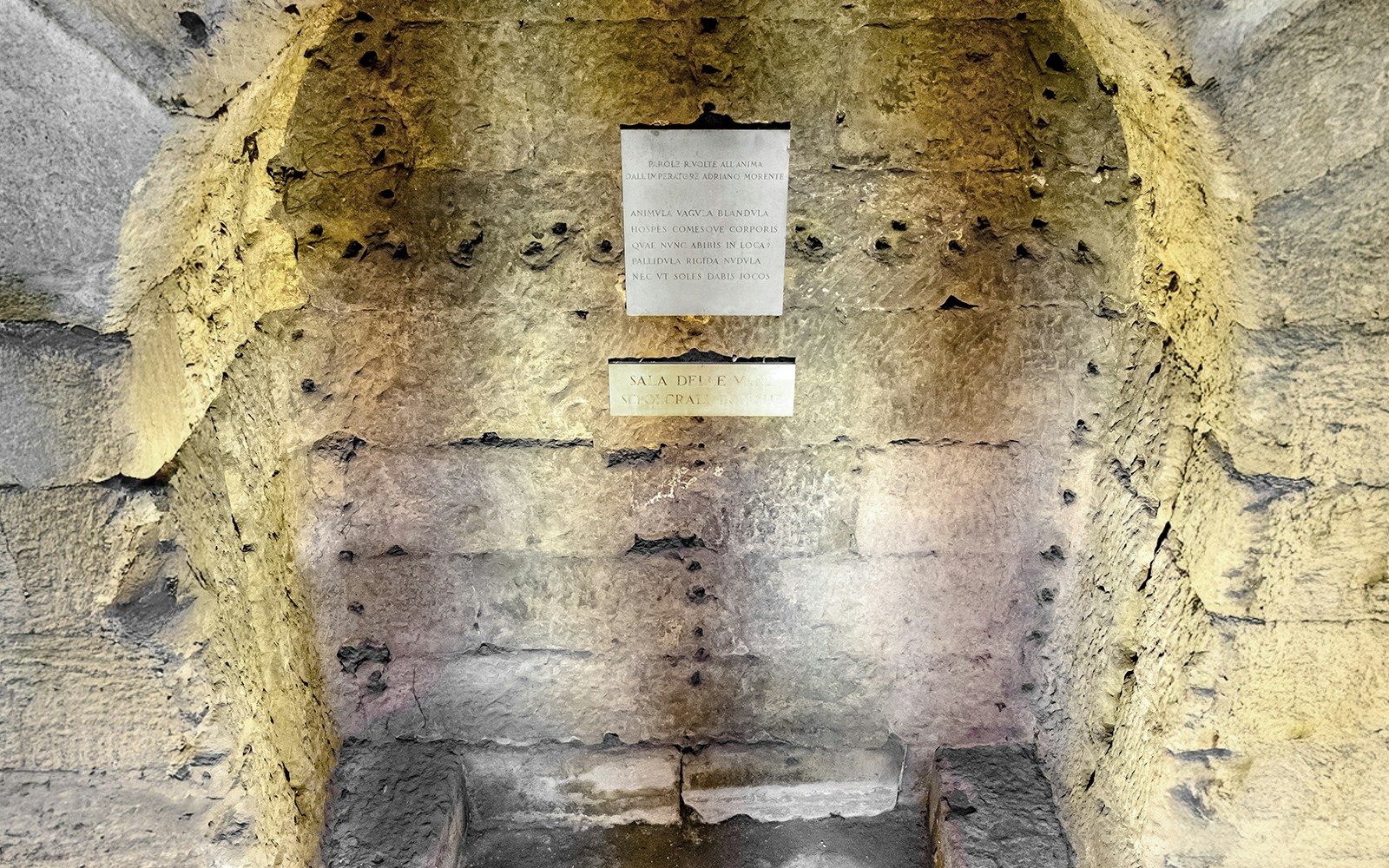 Castel Sant'Angelo Urn Room stone wall with Latin inscriptions.