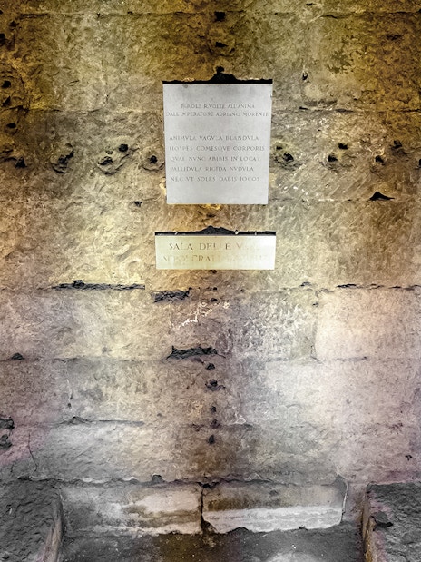 Castel Sant'Angelo Urn Room stone wall with Latin inscriptions.