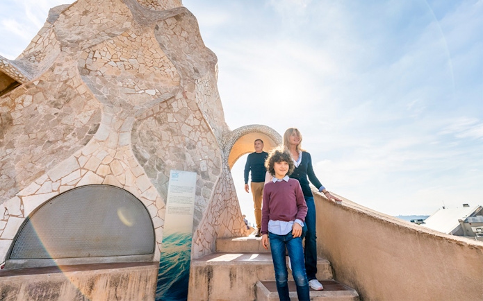 Family exploring Casa Mila Warrior Rooftop in Barcelona.