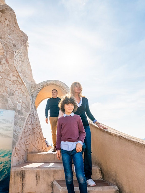 Family exploring Casa Mila Warrior Rooftop in Barcelona.