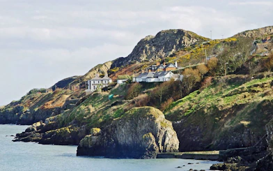 Howth Village coastal cliffs and houses near Dublin.