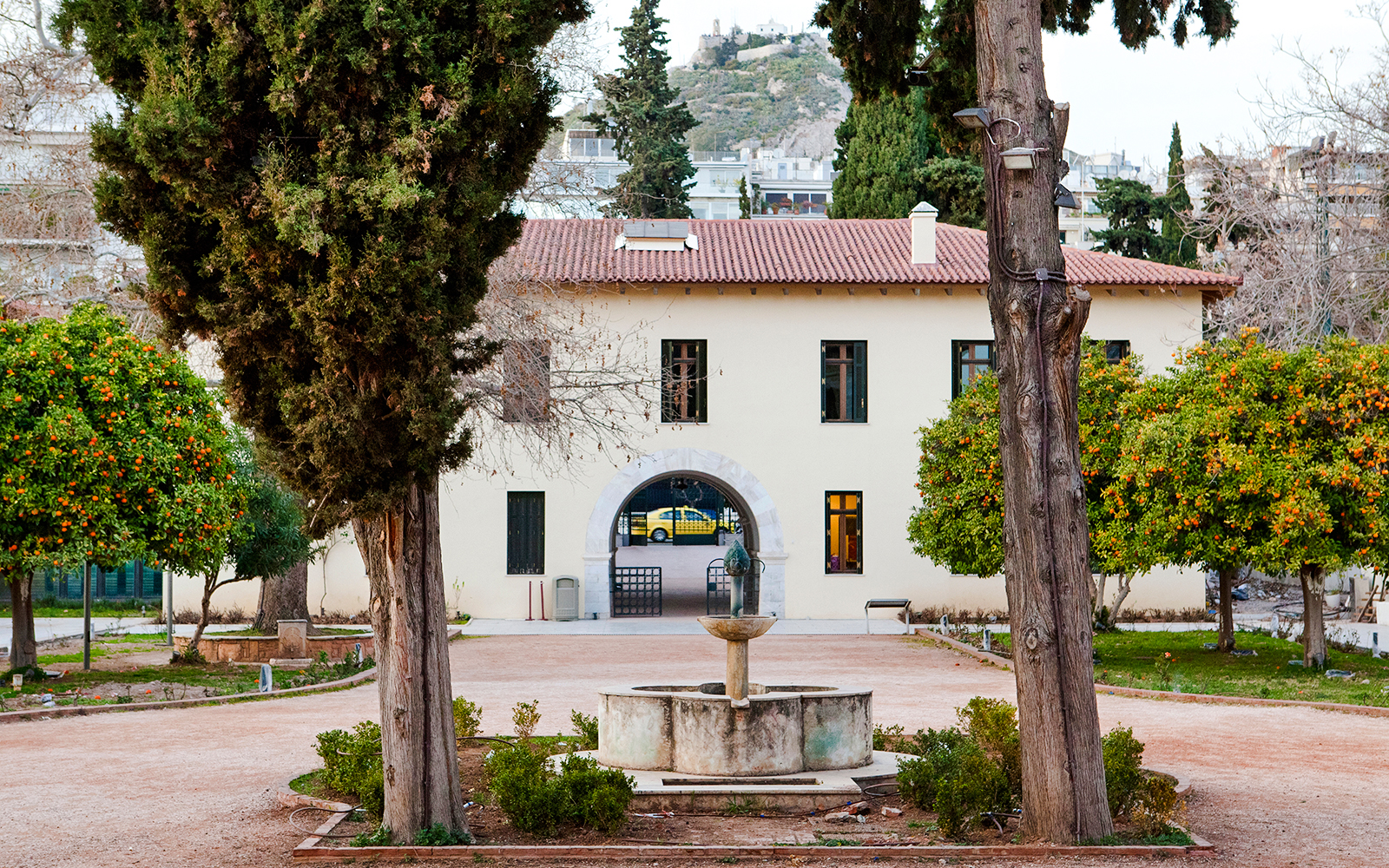 Courtyard view of the Byzantine & Christian Museum in Athens with a central fountain.