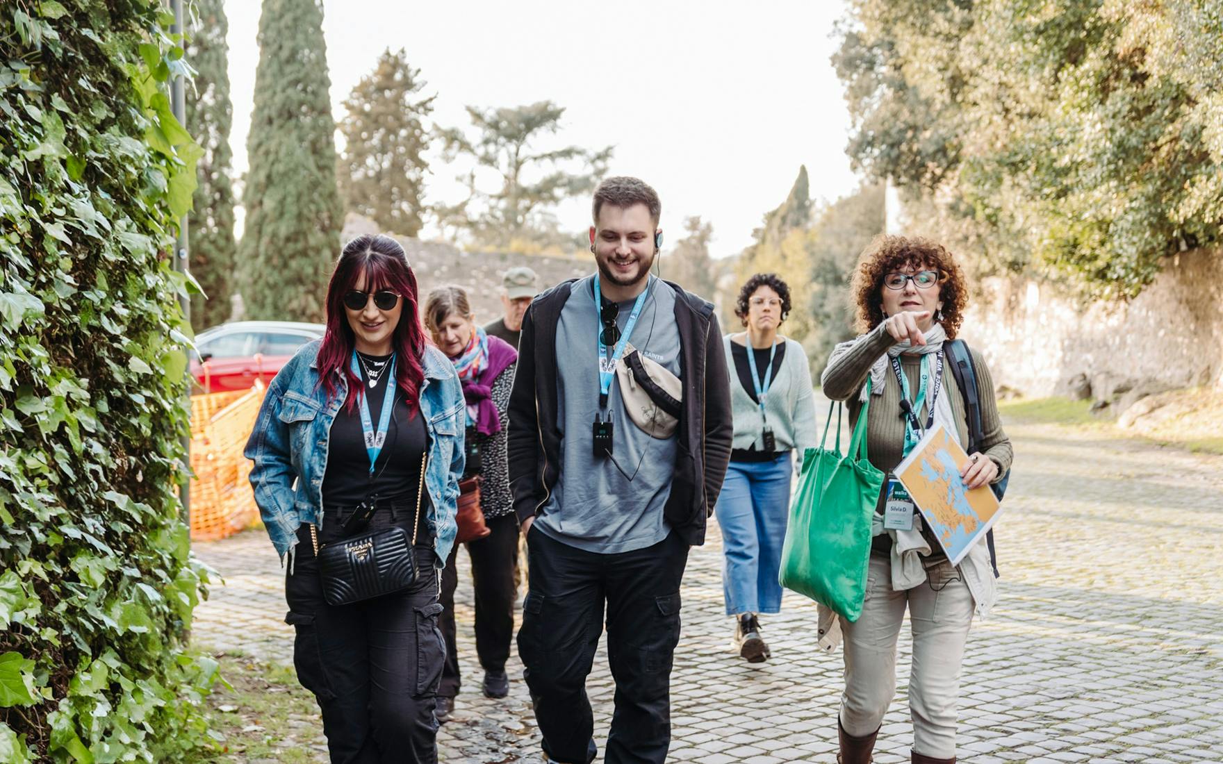 Tour group walking along the Appian Way during the Underground Rome Catacombs Tour.